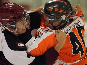 Essex's Chad Hedrick, right, and Dresden's Josh Clements exchange blows in Essex on Tuesday, September 24, 2013. The 73's beat the Jr. Kings 8-2. (TYLER BROWNBRIDGE/The Windsor Star)