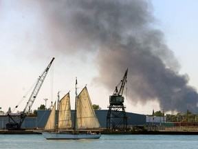 Smoke rises over Detroit across the river from Windsor on Thursday, September 26, 2013. A massive fire destroyed a warehouse in the west end of Detroit.                (TYLER BROWNBRIDGE/The Windsor Star)
