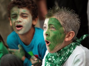 Ryley Owen, left,  and Jack Sinclair, right,  from ƒcole Georges P. Vanier. take part in  Franco-Ontarian Day festivities at Windsor City Hall on September 25, 2013.  French schools from across the area attended the flag raising ceremony and celebration. (JASON KRYK/The Windsor Star)