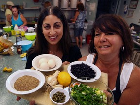 Cooking coach Marianne Haddad, left, and student Leila Chauvin used fresh, healthy choices during class at St. John's Anglican Church recently. (NICK BRANCACCIO / The Windsor Star)