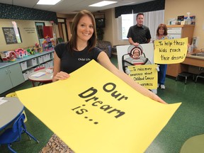 Windsor Regional Hospital Child life specialists Lisa Galbraith, left, and Jennifer Burton Liang, Paul McCann, educational co-ordinator, and Ursula DeBono, local cancer unit coordinator display signs used in a YouTube video featuring local young cancer patients on September 10, 2013 in Windsor.  (JASON KRYK/The Windsor Star)