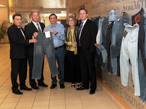 In this file photo, Tom Ferreira, left, account executive, group sales with Great-West Life, Scott Johnstone, regional director of Great-West Life gold key advisor practices for Southwestern Ontario,  Bob Copland, secretary-treasurer of the Windsor and Essex County Cancer Centre Foundation, Norma Brockenshire, president of the Windsor and Essex County Cancer Centre Foundation,  and Sean Hammond of Hammond Insurance of Leamington, and  during a media event announcing that Great-West Life, London Life, and Canada Life contributed $50,000 to the Windsor and Essex County Cancer Centre Foundation's It's in Your Jeans campaign on Monday September 16, 2013. (JASON KRYK/The Windsor Star)
