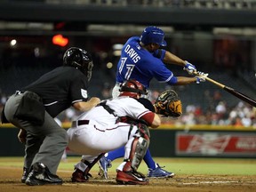 Toronto's Rajai Davis hits a two run home run against the Diamondbacks at Chase Field September 3, 2013 in Phoenix. (Christian Petersen/Getty Images)