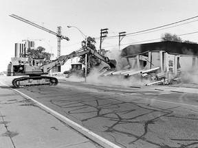 With a dusty crash the former JP's Tavern came tumbling down on Sept. 14, 1988 while workman Tom Hewgill looked on in apparent satisfaction. Dumouchelle Bros. demolition contractors, of McGregor, took about 2-1/2 hours to knock the building down. They're clearing the site at the northwest corner of Janette Avenue and Riverside Drive West to prepare for construction of a $16 million, 17-storey hotel by local developer Tony Rea. (Randy Moore/Windsor Star)