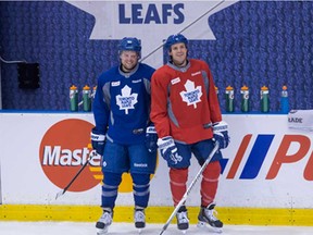 Toronto Maple Leafs Phil Kessel (left) talks to David Clarkson during a practice session at their NHL training camp in Toronto on Thursday September 12, 2013. THE CANADIAN PRESS/Chris Young