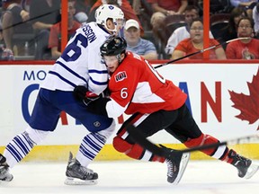 Carl Gunnarsson, left, holds Senator Bobby Ryan off the puck during pre-season NHL action at the Canadian Tire Centre, September 19, 2013, in Kanata. (Wayne Cuddington/Ottawa Citizen)