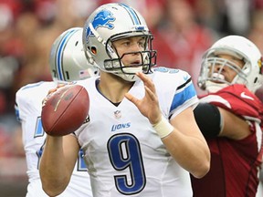 Detroit QB Matthew Stafford drops back to pass during the NFL game against the Arizona Cardinals at the University of Phoenix Stadium on September 15, 2013 in Glendale, Arizona.  The Carindals defeated the Lions 25-21. (Christian Petersen/Getty Images)