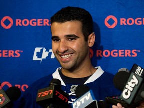 Maple Leafs forward Nazem Kadri laughs as he speaks to the media during the opening day of training camp in Toronto on Wednesday, Sept. 11, 2013. THE CANADIAN PRESS/Nathan Denette