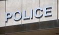The logo above the downtown headquarters of the Windsor Police Service is shown in this 2012 file photo.