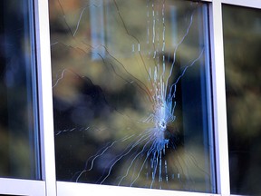 A bullet hole in the window of a ground-floor unit at the Portofino condo building, 1225 Riverside Dr. West. Photographed Sept. 4, 2013. (Dan Janisse / The Windsor Star)