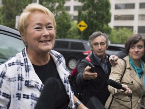 Quebec Premier Pauline Marois smiles as she is questioned over a proposed Charter of Quebec values - THE CANADIAN PRESS/Jacques Boissinot