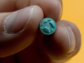 An ecstasy pill is pictured at the RCMP headquarters in Surrey, B.C. Wednesday, June 6, 2012. (Canadian Press files)