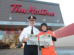 Windsor Police Chief Al Frederick and Matteo Cristofaro on Raise a Reader day at the Tim Horton's on Dougall Ouellette Avenue at Eugenie Street in Windsor, Ontario on September 26, 2013.  (JASON KRYK/The Windsor Star)