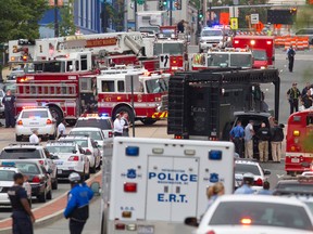 A Emergency Response Team vehicle arrives to the scene where a gunman was reported at the Washington Navy Yard in Washington, on Monday, Sept. 16, 2013. At least one gunman launched an attack inside the Washington Navy Yard, spraying gunfire on office workers in the cafeteria and in the hallways at the heavily secured military installation in the heart of the nation's capital, authorities said.  (AP Photo/Jacquelyn Martin)
