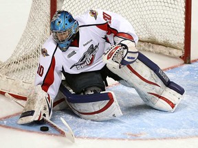 Spitfires goalie Dalen Kuchmey makes a save at the WFCU Centre in Windsor September 6, 2013. Kuchmey has earned the backup job in Windsor. (TYLER BROWNBRIDGE/The Windsor Star)