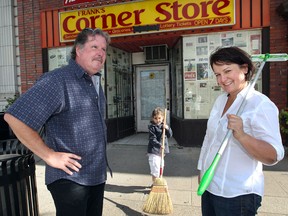 Louise Jones, right, and her husband, Bill Hucker, and their five-year-old granddaughter, Falynne Miller, are cleaning and renovating a storefront on Wyandotte Street East and opening a grocery store. (NICK BRANCACCIO / The Windsor Star)