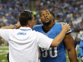 Detroit Lions head coach Jim Schwartz, left, talks with Ndamukong Suh  on the sidelines during the game against the Minnesota Vikings at Ford Field on September 8, 2013 in Detroit. Suh is appealing his $100,000 fine for an illegal block against the Vikings. (Leon Halip/Getty Images)