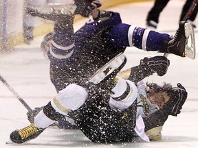 LaSalle's Connor Rosaasen, battom, and London's Matt Fuller collide during Jr. B action at the Vollmer Centre in LaSalle on Wednesday, September 11, 2013. (TYLER BROWNBRIDGE/The Windsor Star)