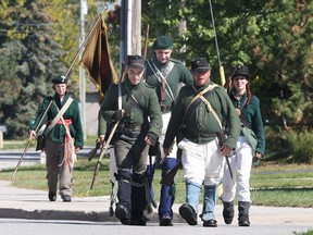 A group of war of 1812 re-enactors landed in Lakeshore Friday, Sept. 27, 2013, at the Puce River Harbour Marina. The troop was recreating part of the British retreat of southwestern Upper Canada during 1813. They marched along East Puce River Road on their way to the Maidstone Museum. (Windsor Star files)