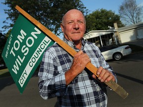 Tom Wilson holds up the only remaining election sign he still has in front of his home in Windsor on Wednesday, September 11, 2013. Wilson is running for the vacant Ward 7 seat.          (TYLER BROWNBRIDGE/The Windsor Star)
