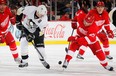 Detroit's Cory Emmerton, right, battles Pittsburgh's Evgeni Malkin during pre-season action at Joe Louis Arena on September 25, 2013 in Detroit, Michigan. (Photo by Gregory Shamus/Getty Images)