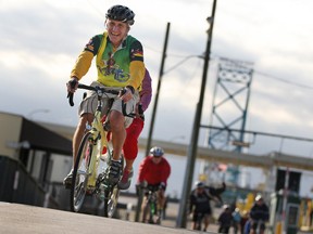 Cyclists participating in the Tour de Troit's Bike the Bridge make their way off the Ambassador Bridge, Sunday, Oct. 13, 2013.  The tour included a back and forth trek over the Ambassador Bridge and a 20-mile pedal through Southwest Detroit.  (DAX MELMER/The Windsor Star)