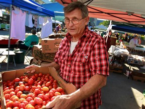 Bob Arquette, from Mimi's Fruit and Vegetables, sells his produce at the Downtown Windsor Farmers' Market on the final day of the season, Saturday, Oct. 12, 2013.  (DAX MELMER/The Windsor Star)