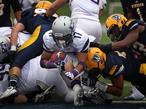 Western running back, Yannick Harou, makes his way into the end zone during OUA football action between the University of Windsor and Western at Alumni Field, Saturday, Oct. 5, 2013.  (DAX MELMER/The Windsor Star)