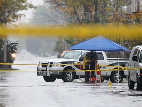 Windsor police investigate an early morning fatal stabbing at the intersection of Park Street and Pelissier Street Saturday, Oct. 19, 2013. DWBIA chairman Larry Horwitz says it's time to make the city core safer.  (DAX MELMER/The Windsor Star)