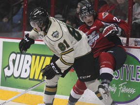 Windsor's Graeme Brown, right, is checked by London's Remi Elie at the WFCU Centre. (DAN JANISSE/The Windsor Star)