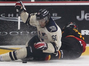 Windsor's Josh Ho-Sang, right, collides with Belleville's Scott Simmonds at the WFCU Centre. (DAX MELMER/The Windsor Star)