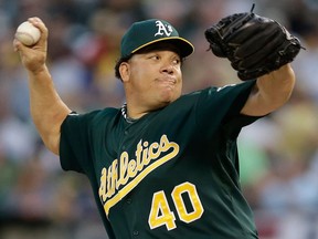 Oakland's Bartolo Colon delivers a pitch in the first inning of Game 1 of the ALDS against the Detroit Tigers in Oakland. (AP Photo/Marcio Jose Sanchez)