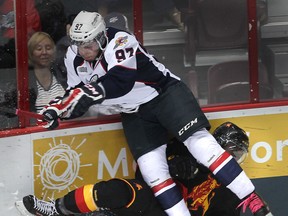 Windsor's Brady Vail, top, hits Belleville's Jordan Subban Thursday at the WFCU Centre. (DAN JANISSE/The Windsor Star)