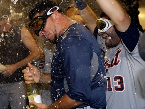 Detroit's Joaquin Benoit celebrates in the locker-room after the Tigers beat the Athletics 3-0 to win Game 5 of the American League division series in Oakland. (AP Photo/Ben Margot)