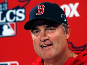 Boston manager John Farrell talks to the media during a news conference prior to a team workout at Fenway Park. (AP Photo/Elise Amendola)