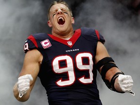 Houston's J.J. Watt is introduced to the crowd at Reliant Stadium Sunday in Houston. (Photo by Bob Levey/Getty Images)