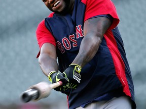 Boston's David Ortiz swings a bat during practice at Comerica Park Monday. (AP Photo/Paul Sancya)