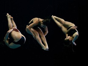 Multiple exposures of Canadian diver Pamela Ware in the Women's 3m springboard final during the FINA/Midea Diving World Series 2013 on April 20, 2013 in Edinburgh, Scotland.  (Clive Rose/Getty Images)