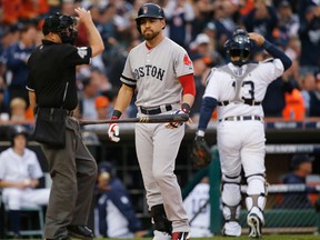 Boston's Jacoby Ellsbury, centre, tosses his bat after striking out in the third inning during Game 3 of the American League championship series against the Detroit Tigers Tuesday. (AP Photo/Paul Sancya)