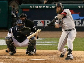 Boston's Mike Napoli, right, hits a home run in the seventh inning during Game 3 of the American League championship series against the Detroit Tigers Tuesday. (AP Photo/Charlie Riedel)