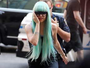 Amanda Bynes makes an appearance at Manhattan Criminal Court on July 9, 2013 in New York City on charges of reckless endangerment, tampering with evidence and criminal possession of marijuana in relation to her arrest on May 23, 2013.  (Neilson Barnard/Getty Images)