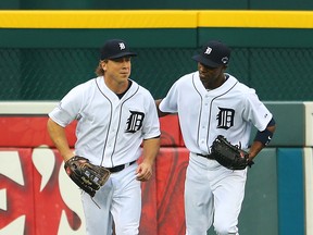 Detroit's Andy Dirks, left, and Austin Jackson head to the dugout after Dirks caught a ball hit by David Ortiz of the Red Sox in the fourth inning of Game 3 of the American League Championship Series at Comerica Park. (Photo by Mike Ehrmann/Getty Images)