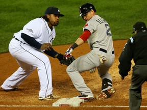 Boston's Jacoby Ellsbury, right, makes it safely back to first against Detroit's Prince Fielder in the third inning of Game 4 of the American Championship Series at Comerica Park.  (Photo by Mike Ehrmann/Getty Images)