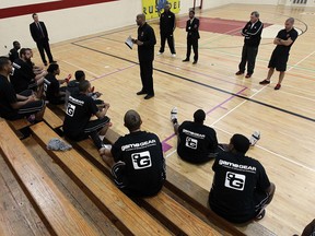Express coach Bill Jones talks to members of the team at their new practice facility at the Rose City Islamic Centre in Windsor. (TYLER BROWNBRIDGE/The Windsor Star)