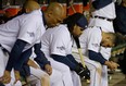 Detroit's Prince Fielder, second from right, sits in the dugout in the ninth inning during Game 5 of the American League championship series against the Boston Red Sox Thursday. (AP Photo/Matt Slocum)