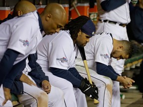 Detroit's Prince Fielder, second from right, sits in the dugout in the ninth inning during Game 5 of the American League championship series against the Boston Red Sox Thursday. (AP Photo/Matt Slocum)