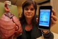 Madonna Ferrone, co-ordinator primary care, Lung Health Program, displays an app developed to assist patients with asthma, October 31, 2013. (NICK BRANCACCIO/The Windsor Star)