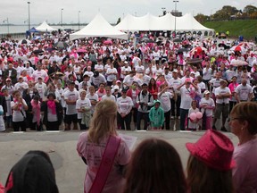 A large crowd of CIBC Run for the Cure participants listen as Jillianne McGonigal, 26, a breast cancer survivor, shares her story of her fight with cancer, at the Riverfront Festival Plaza, Sunday, Oct. 6, 2013.  McGonigal was first diagnosed with breast cancer at age 23 and has been cancer free for two years.  (DAX MELMER/The Windsor Star)