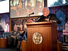In this photo provided by St. Louis University, the Rev. John Padberg, S.J., director of the Institute of Jesuit Sources, speaks during a panel discussion at St. Louis University in St. Louis, Tuesday, Oct. 29, 2013, about the month-long 1949 demon-purging ritual at the school’s former Alexian Brothers Hospital. The treatment of an unidentified suburban Washington, D.C., boy formed the basis for the 1971 novel by William Peter Blatty, The Exorcist, and the film of the same name two years later. Listening from left to right, are: Thomas B. Allen, author of Possessed: The True Story of an Exorcism, and John Waide, archivist at Saint Louis University. (AP Photo/St. Louis University, Michelle Peltier)