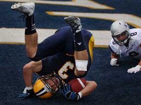 Windsor's Beau Lumley lands in the end zone for a touchdown as the University of Windsor hosts Western at Alumni Field in OUA football action, Saturday, Oct. 5, 2013.  Western defeated Windsor 51-23.  (DAX MELMER/The Windsor Star)